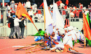 Participants wait for the chief guest at the games venue. 