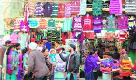 Strong going: Residents throng shops at telephone exchange chowk in the walled city in Amritsar on Wednesday