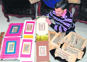 Rajnish Khosla shows his collection of rare ancient manuscripts in Amritsar on Wednesday
