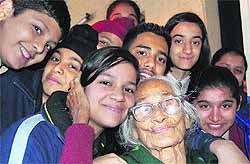 Students of Shemrock School with an inmate of old-age home in Sector 15, Chandigarh, on Wednesday