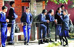 Despite the orders of the Education Department staggering the school timings, boys and girls end up congregating at a bus stop in Chandigarh on Wednesday
