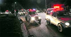 Police vehicles zoom past each other after the UT SSP directed policemen to man city roads and ensure the safety of women; and (below) policemen disperse after the meeting