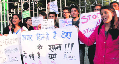 Members of Yo Zindagi, a youth organisation, stage a demonstration against the Delhi gang-rape incident at Gandhi Park in Dehradun on Wednesday.
