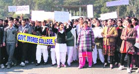 College students hold a protest against the Delhi gang-rape case in Samba district on Wednesday