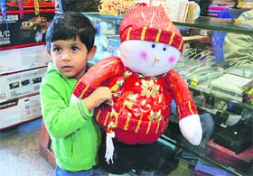 A child holds a Christmas gift
