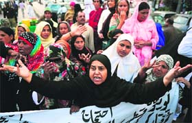 Polio vaccination workers protest against the killing of their colleagues in Karachi on Wednesday