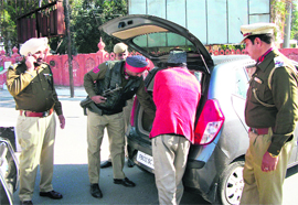 Police personnel check a vehicle ahead of conference of police commissioners in Amritsar on Thursday. 
