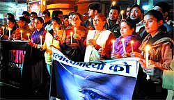 Members of various NGOs and city residents during a candle light march held to protest against the recent incident of gang rape in Delhi, at the Fire Brigade Chowk in Bathinda on Thursday evening