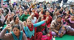 Bank officials sit on a strike against the Banking Laws (Amendment) Bill, 2012, in Bathinda on Thursday
