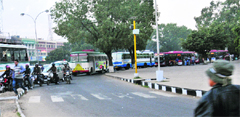 Buses coming out of the bus stand add to chaos. 