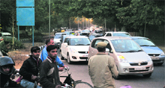 Only a few traffic policemen are deployed at the road as a result it becomes difficult for them to regulate vehicular movement.