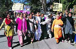 Women stage a march against the Delhi gang-rape incident in Mussoorie on Thursday