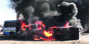 Vehicles torched by a mob protesting against an accident which left one dead and six injured in Nuh on Thursday. 