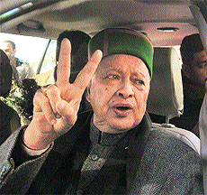Virbhadra Singh flashes the victory sign.