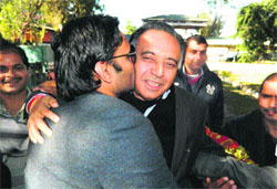 Son RS Bali kisses his father GS Bali after he was declared elected from Nagrota Bagwan for the third consecutive term.