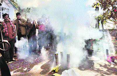  Congress supporters fire crackers at the Holy Lodge, Virbhadra Singhs residence, in Shimla on Thursday.