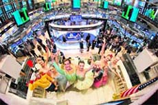 The cast of New York City Ballet's production of The Nutcracker ring the opening bell at the New York Stock Exchange. ICE agreed to a $8 billion deal to buy exchange owner NYSE Euronext on Thursday, propelling the commodities player into the big league of European derivatives and helping it to take on arch rival CME Group.