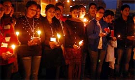 Doctors and students of the Adesh University take out a candle light march to express their solidarity with the 23-year-old girl who was gangraped and brutally beaten in Delhi, in Bathinda on Friday.
