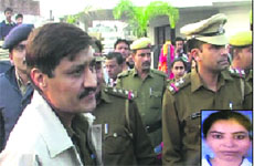 Police personnel outside the residence of Doon MLA Ram Kumar Chaudhary on Friday, who is an accused in the Jyoti (inset) murder case. 
