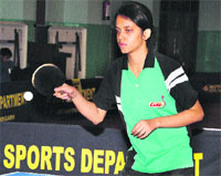 Kalyani Kakkar, who won the Chandigarh State Tennis Championship, in action during a match in Chandigarh on Friday.