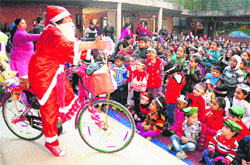 Students of Tribune Model School celebrate Christmas with Santa Claus in Sector 29, Chandigarh, on Friday.