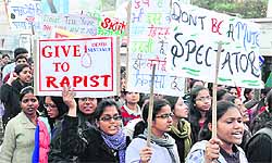 Students of the National Dairy Research Institute hold placards during a protest in Karnal on Friday against the gang rape of a student in New Delhi