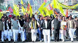 Activists of the BJP-HJC combine protest against the hike in bus fares in Karnal on Friday