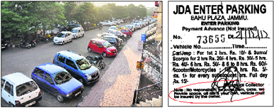 Cars at a parking lot of the JDA at Bahu Plaza in Jammu and a parking slip says the contractor was not responsible for any theft.