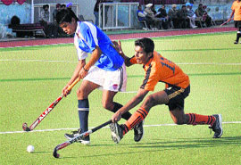 A match in progress between BSNV Inter-College Lucknow (blue) and St Paul School Mumbai during the ninth All India Balwant Singh Kapoor Hockey Tournament at Olympian Surjit Hockey Stadium in Jalandhar on Friday. 