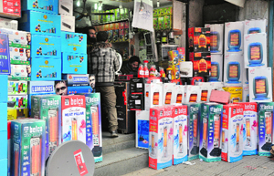 A shopkeeper sells gas and electric heaters in Srinagar.