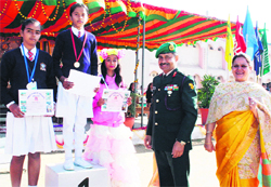 Brig AS Chauhan honours students of Army Public School in Amritsar on Saturday. A Tribune photo