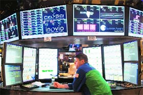 A trader works on the floor of the NYSE on Friday. US stocks finished lower on Friday after a Republican plan to avoid the "fiscal cliff" failed to gain sufficient support on Thursday night, draining hopes that a deal would be reached before 2013