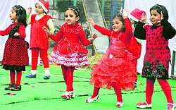Tiny tots perform a dance during the annual day function of Kids 'R' Kids in Chandigarh on Saturday
