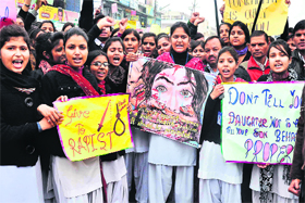 Call for justice: Girl students stage a march demanding stringent laws against rape and sexual harassment at Chinmaya College of Science in Haridwar on Saturday.