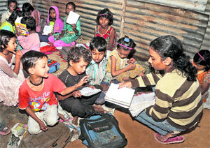 Children of migrant labourers at a class on the JNU campus in Delhi.
