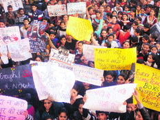 Students of schools and colleges demand justice for rape victims in Palampur on Saturday.