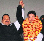 Devender Singh Rana, political adviser to Chief Minister Omar Abdullah, with a new entrant in Jammu on Saturday. Tribune photo: Inderjeet Singh