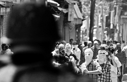A file photo of protesters attacking the police.
