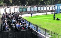 Fans line up to buy tickets at the Chinaswamy Stadium in Bengaluru