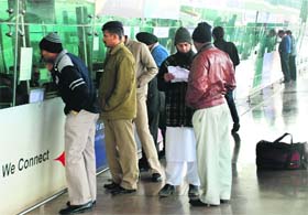 Passengers at an enquiry counter