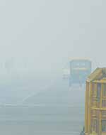A blanket of thick fog covered Rajpath in New Delhi on Sunday