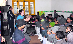 Foreign students teach children at a Katapathar school in Dehradun district as part of the Round Square international project.