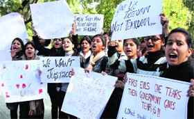 Girls hold a protest against the Delhi gang-rape incident during a campaign launched by MAD, a youth organisation, at Gandhi Park in Dehradun on Sunday.