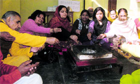 Members of Shaambhavi, a social organisation, perform a havan in support of the Delhi gang-rape victim in Dehradun on Sunday.
