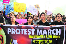 Girl students take out a protest march in Hisar on Sunday.