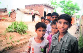 Children roam in the streets of Chak Bhutey village, Jammu