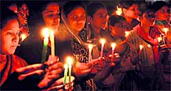 Girls hold a candlelight march against Delhi gang rape in Patiala on Saturday