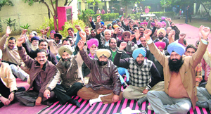 Patwaris protest in support of their demands in Jalandhar on Monday.
