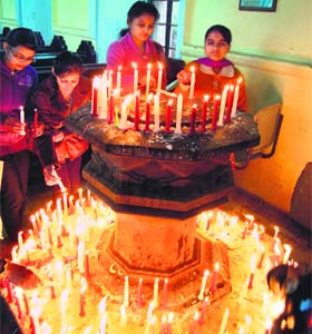 Celebration time: Girls light candles at St Paul's Church to celebrate Christmas in Amritsar on Tuesday