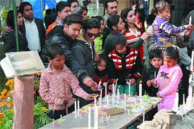Devotees light candles at the St Xaviers church